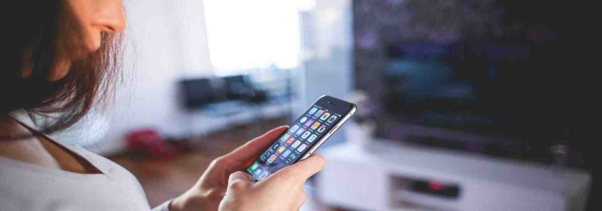 Close-up of a woman using a smartphone, representing seamless digital connectivity and hassle-free travel planning. With Tyndis Travel, explore effortless booking, personalized India tour packages, and expertly curated experiences for a smooth and enriching journey.