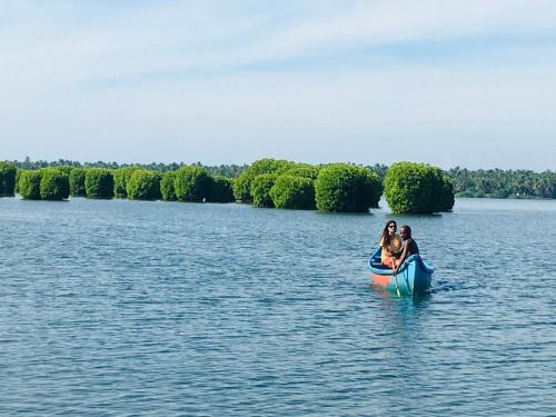 Kayaker moving towards the wider parts of the backwaters